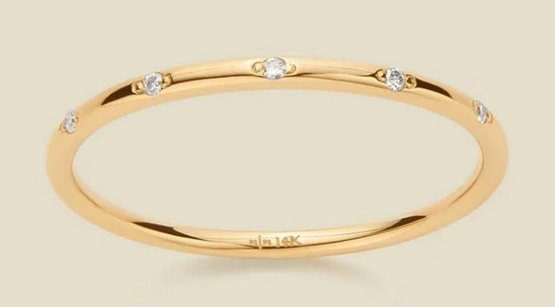 Stardust Diamond Ring - Size 7: Stardust Diamond Ring - Size 7 Embrace the brilliance of the night sky with the Stardust Diamond Ring. Crafted in 14k solid gold, this delicate, stackable band is adorned with five single-cut round