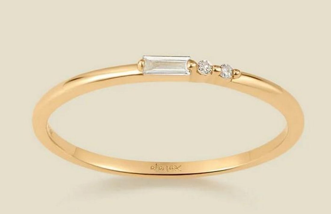 Stellar Nova Diamond Ring - Size 8: Stellar Nova Diamond Ring - Size 8 Embody the brilliance of the stars with the Nova Diamond Ring. Crafted in 14k solid gold, this stunning band features a radiant baguette-cut diamond flanked by two