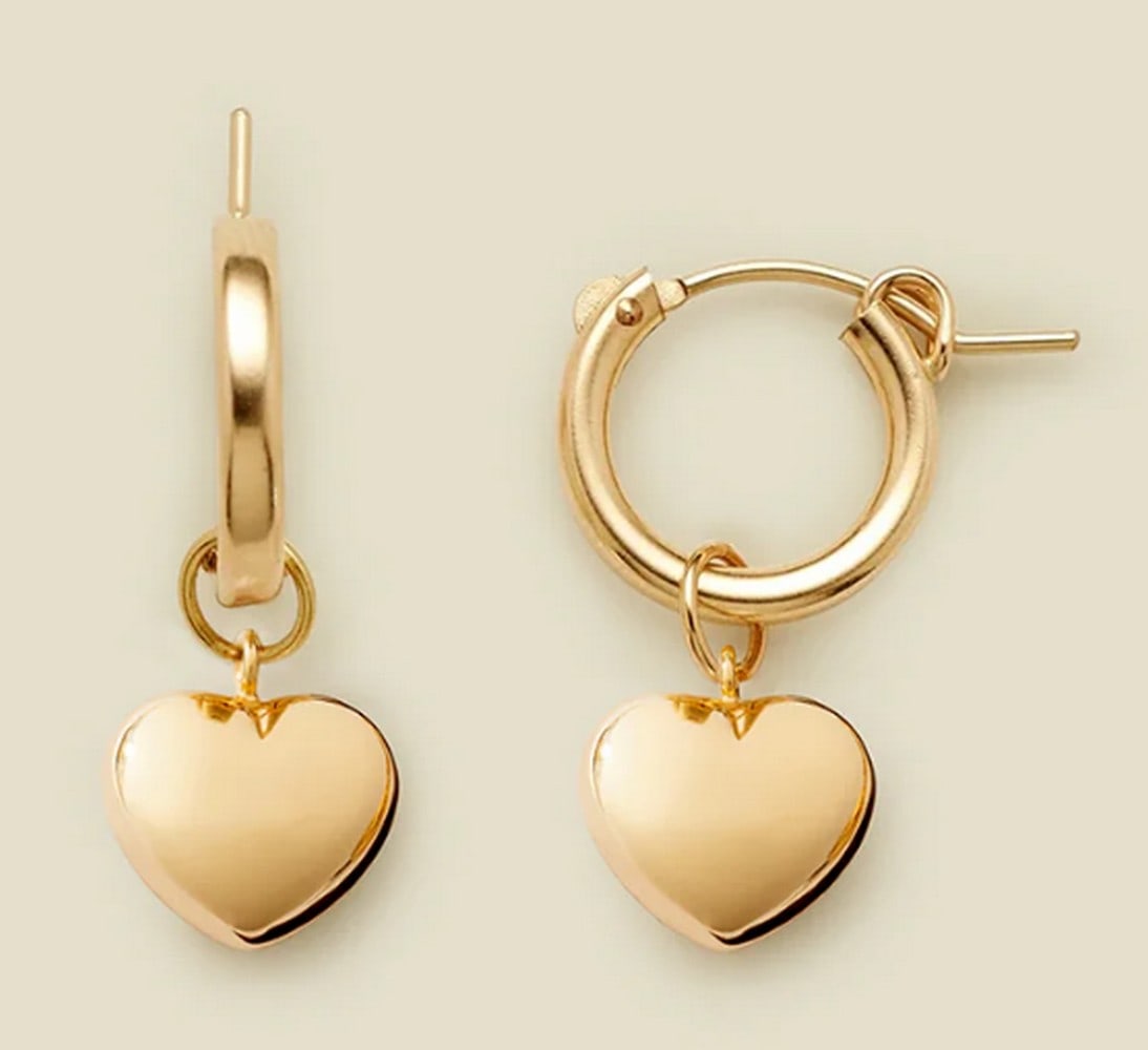 14k Gold Filled Puffy Heart Hoop Charm Earrings: 14k Gold Filled Puffy Heart Hoop Charm Earrings Give your ears some love with these polished 3D heart hoop earrings. Our signature Maude Hoops feature tiny puffy heart charms, adding a touch of