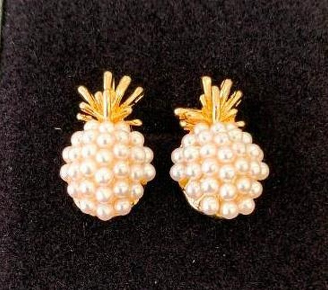Pearl Pineapple Stud Earrings: Pearl Pineapple Stud Earrings Add a bit of fun elegance to your jewelry collection with these gold-plated pineapple stud earrings, beautifully accented with delicate mini pearls. A perfect blend