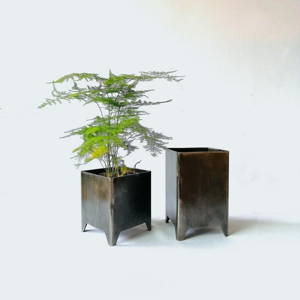 Industrial Charm Recycled Metal Planter Set: Industrial Charm Recycled Metal Planter Set Enhance your garden with this charming pair of industrial planters, thoughtfully designed to blend modern aesthetics with eco-consciousness. Crafted from re