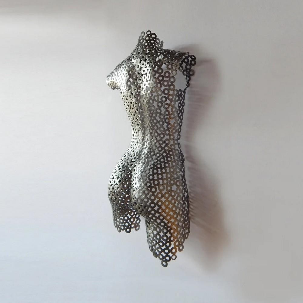 Feminine Strength Metal Sculpture: Feminine Strength Metal Sculpture This impressive Feminine Strength Metal Sculpture embodies the perfect balance of beauty, strength, and feminine delicacy. Crafted with meticulous care, each curve an