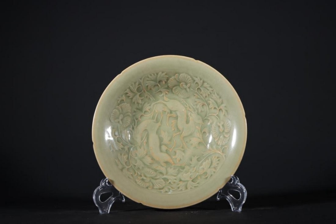 Plate with Carved Floral and Deer Motif: Plate with Carved Floral and Deer Motif A finely crafted Yaozhou ware kuikou (notched-rim) plate inspired from the Song Dynasty, measuring 20.3 cm in diameter. This classic celadon-glazed piece featu