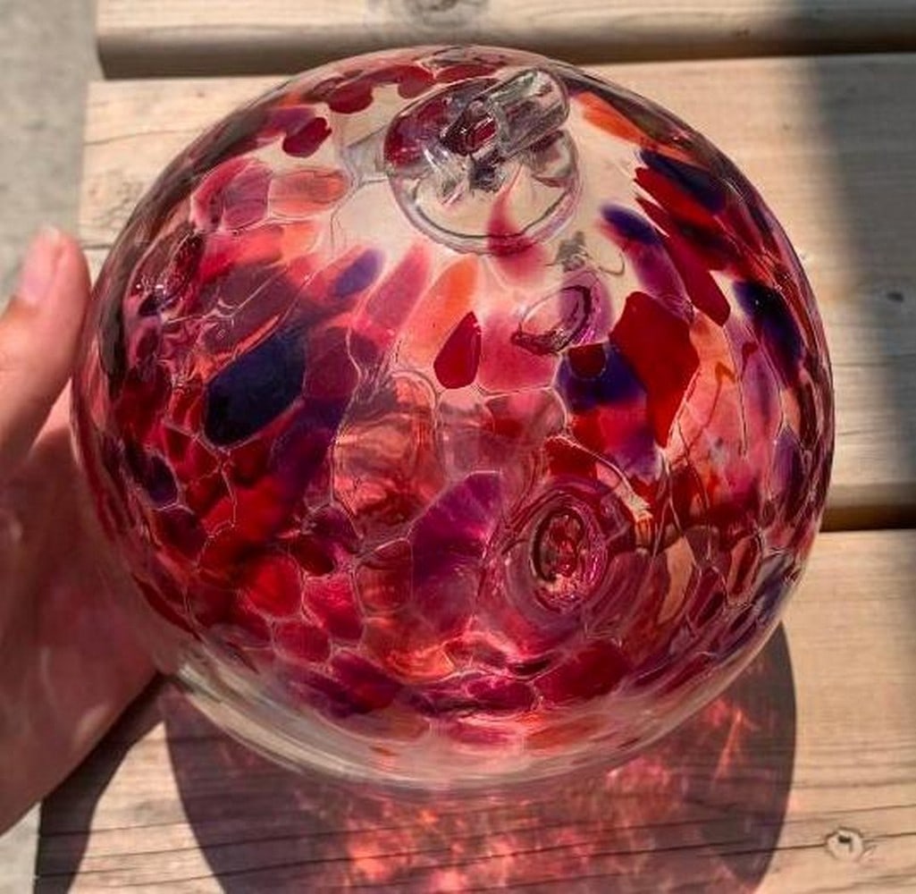 Handblown Glass Tree of Love Window Ornament: Handblown Glass Tree of Love Window Ornament Celebrate beauty, warmth, and connection with this stunning handblown glass window ornament. Swirling with a soft pink hue, this elegant piece features