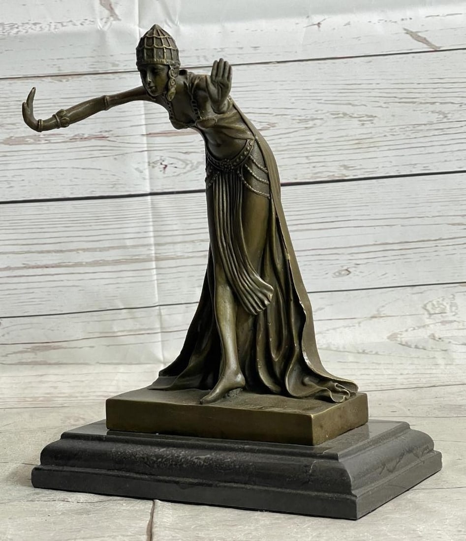 Dancing Egyptian Princess Bronze Sculpture - 12" x 5": Dancing Egyptian Princess Bronze Sculpture - 12" x 5" This Egyptian princess bows graciously with her hands out to her side as her long royal flowing dress cascades around down her legs and b