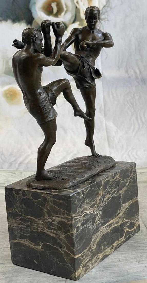 2 Kickboxers Original Signed Bronze Sculpture: 2 Kickboxers Original Signed Bronze Sculpture Witness the intensity and determination captured in this remarkable bronze sculpture. In the final round of a fierce match, our skilled kickboxer finds h