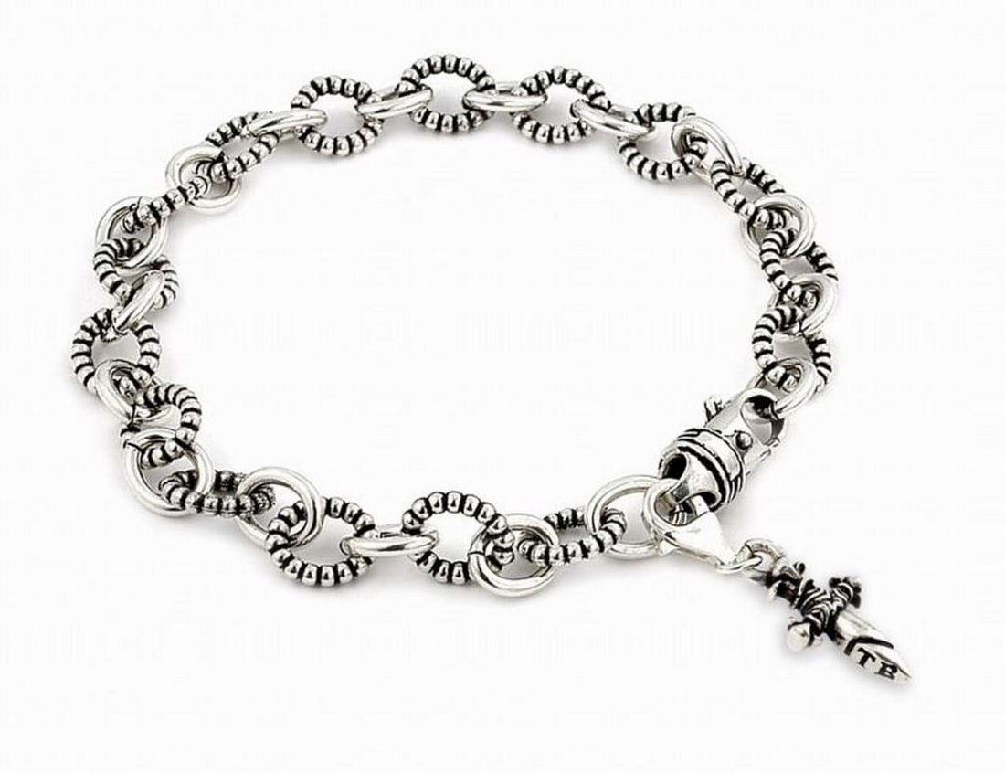 Twisted Blade 925 Sterling Silver Beaded Bracelet with Dagger Charm: Twisted Blade 925 Sterling Silver Beaded Bracelet with Dagger Charm Twisted Blade is made from .925 Sterling Silver, featuring a silver beaded bracelet with a small dangling dagger charm, meticulousl