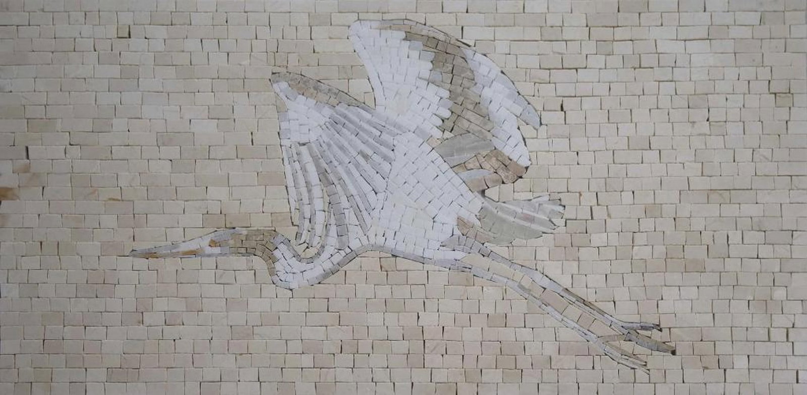 Heron Mosaic: Heron Mosaic A handcrafted marble mosaic depicting a white flying heron in warm white and beige tones. Made from natural stones, this piece highlights texture and detail, capturing the grace and