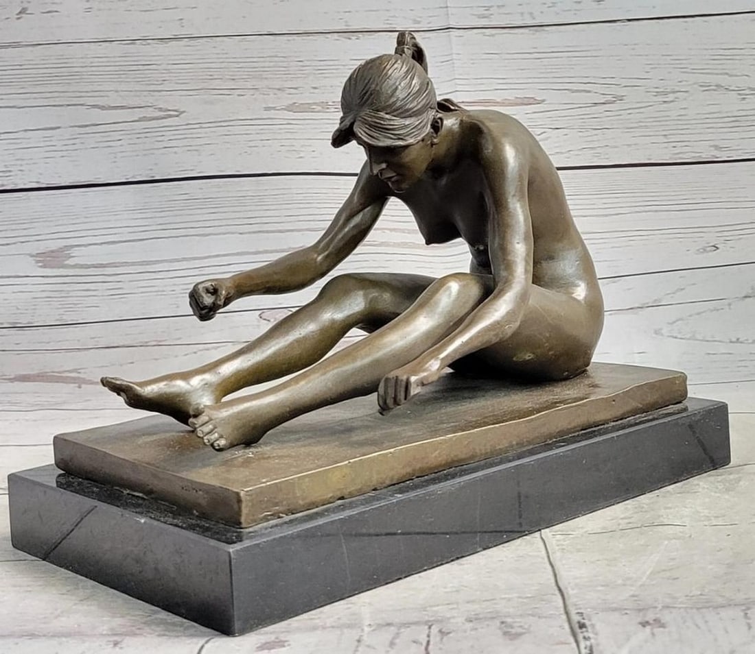 Women in Nude Yoga Pose Bronze Statue - 9" x 11": Women in Nude Yoga Pose Bronze Statue - 9" x 11" Immerse yourself in the captivating allure of this bronze statue, featuring a confident young woman exuding timeless charm. Her provocative yet