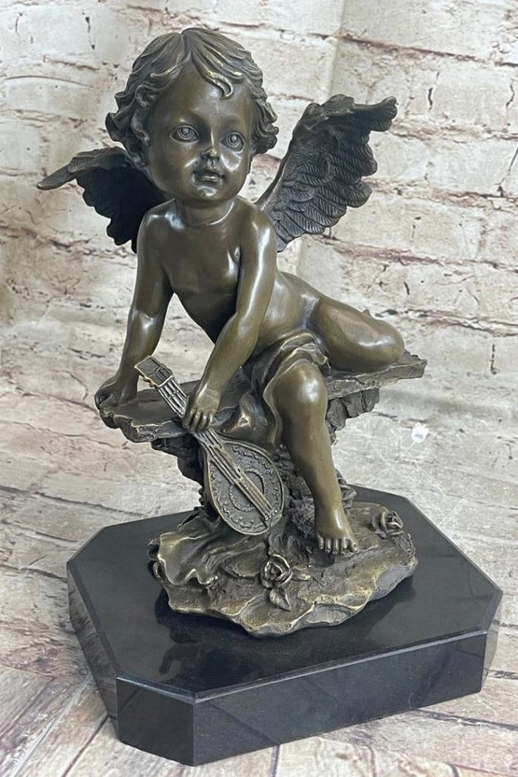 French Renaissance Cherub Putti Spelter Bronze Figurine: French Renaissance Cherub Putti Spelter Bronze Figurine The cherubic angel seems to have just landed from great heights among the ruins of an old enchanted garden. He holds himself steady from the fa