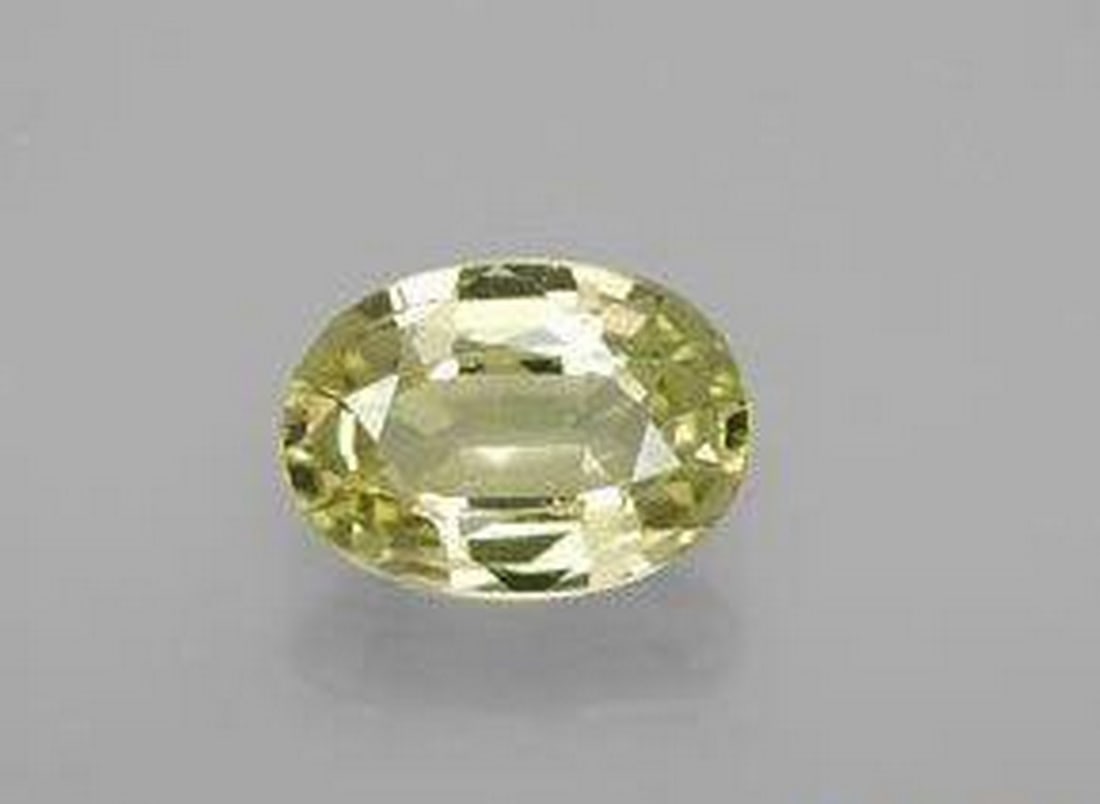 1.14 ct Natural Lemon Yellow Chrysoberyl, Oval Cut, VS, Sri Lanka: 1.14 ct Natural Lemon Yellow Chrysoberyl, Oval Cut, VS, Sri Lanka Natural chrysoberyl gemstone weighing 1.14 carats, cut in an oval facet shape with a lemon yellow color. The gem measures 7.79 x 5.57