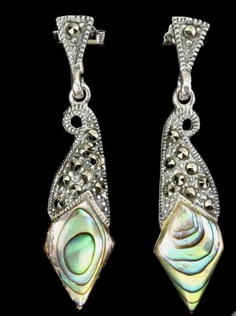 Mother of Pearl & Marcasite Earrings: Mother of Pearl & Marcasite Earrings These exquisite 925 sterling silver earrings feature luminous Mother of Pearl accented with shimmering marcasite gemstones, creating a timeless and sophisticat