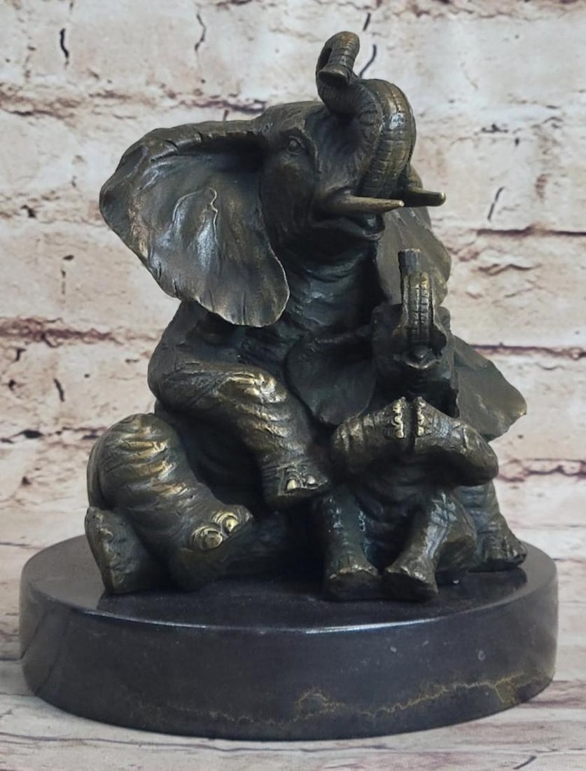 Mother & Baby Bronze Sculpture: Mother & Baby Bronze Sculpture The Elephant family celebrates the unbreakable bond between mother and child. the artist captures a sweet moment between mother and child and uses the lost-wax meth