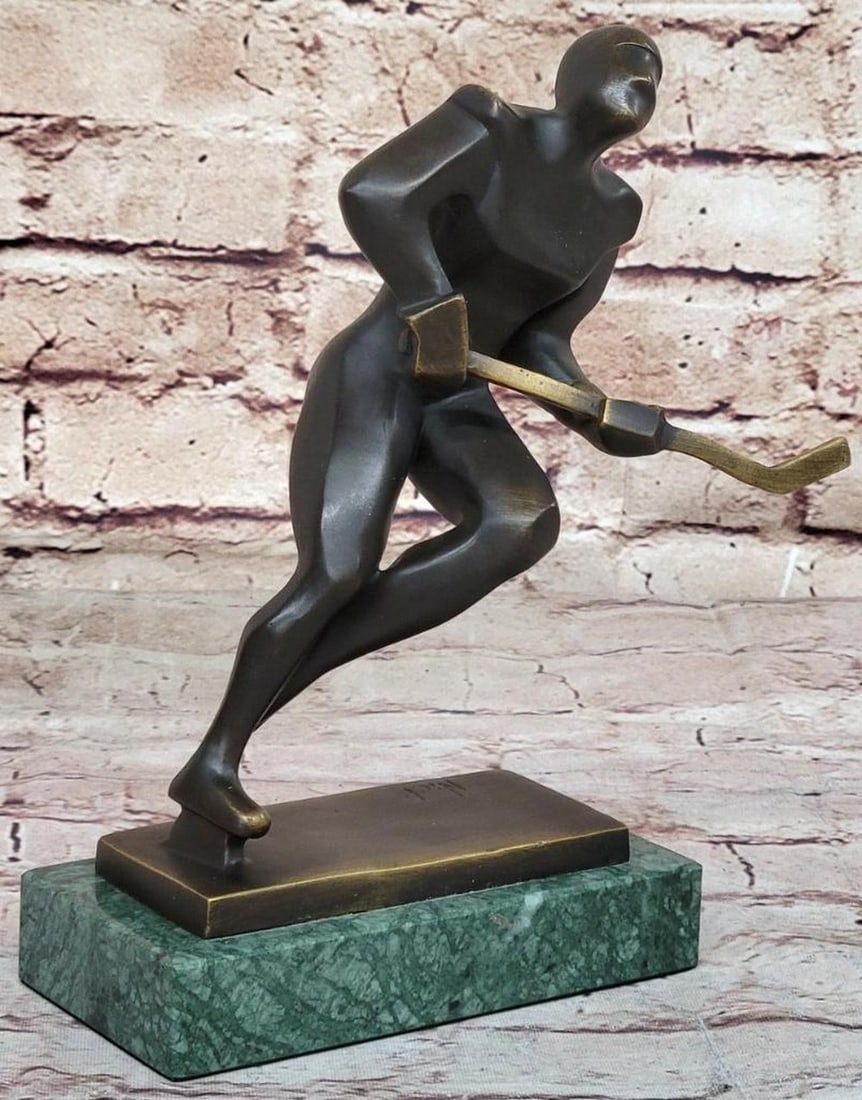 Mario Nick OriginalSigned Bronze Hockey Sculpture on Marble Base - 8" x 8": Mario Nick Original Signed Bronze Hockey Sculpture on Marble Base - 8" x 8" Celebrate the spirit of hockey with this exquisite Genuine Bronze Sculpture by artist Mario Nick. Standing proudly