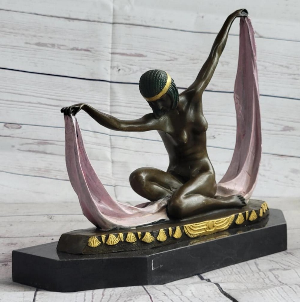 Art Deco Nude Female Scarf Dancing "Flapper Girl" Bronze Sculpture by Mirval 10" x 12": With extreme grace and expertise this dancer strikes her beginning pose. She bows her head and holds a long yellow sash, that stretches from arm to arm. She sits on the soles of her feet, folding her