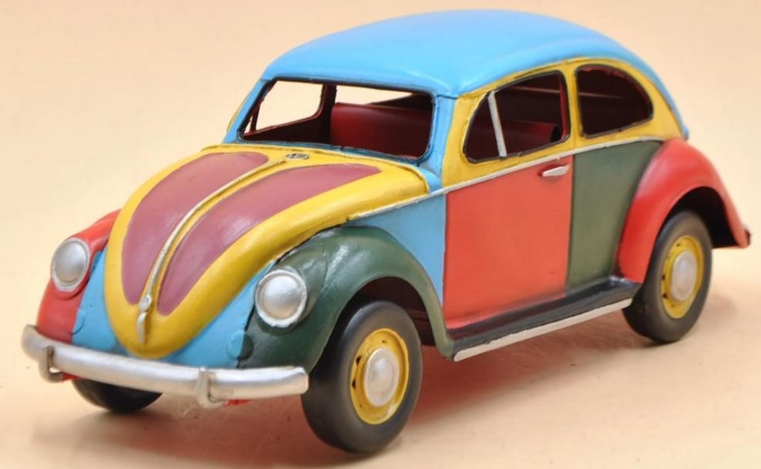 Vibrant Vision: 1934 Volkswagen Beetle Rainbow Edition: Vibrant Vision: 1934 Volkswagen Beetle Rainbow Edition This stunning 1/12 scale die-cast model of the 1934 Volkswagen Beetle is a bold and playful tribute to the iconic car, reimagined with a