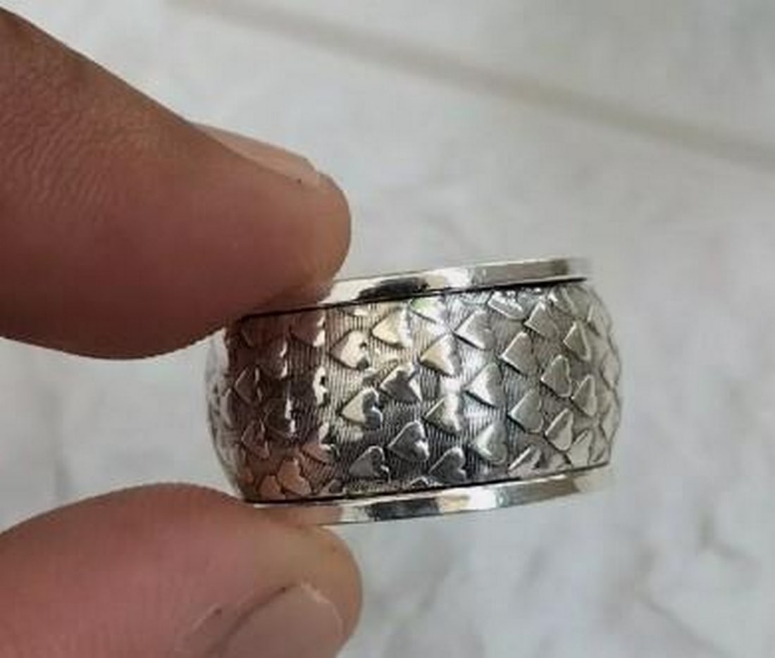 Love's Embrace Sterling Silver Heart Band: Love's Embrace Sterling Silver Heart Band A symbol of timeless affection, this Love's Embrace band ring is crafted from 925 sterling silver, featuring a delicate heart design that wraps