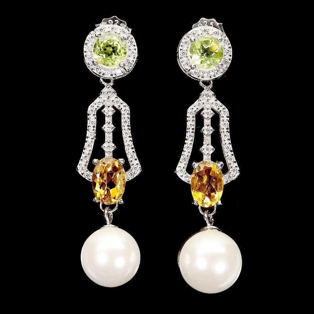 Oval Citrine & Peridot 7x5mm Dangle Sterling Silver Earrings: Oval Citrine & Peridot 7x5mm Dangle Sterling Silver Earrings Add a pop of color with these Oval Citrine & Peridot Dangle Sterling Silver Earrings. Featuring vibrant citrine and peridot
