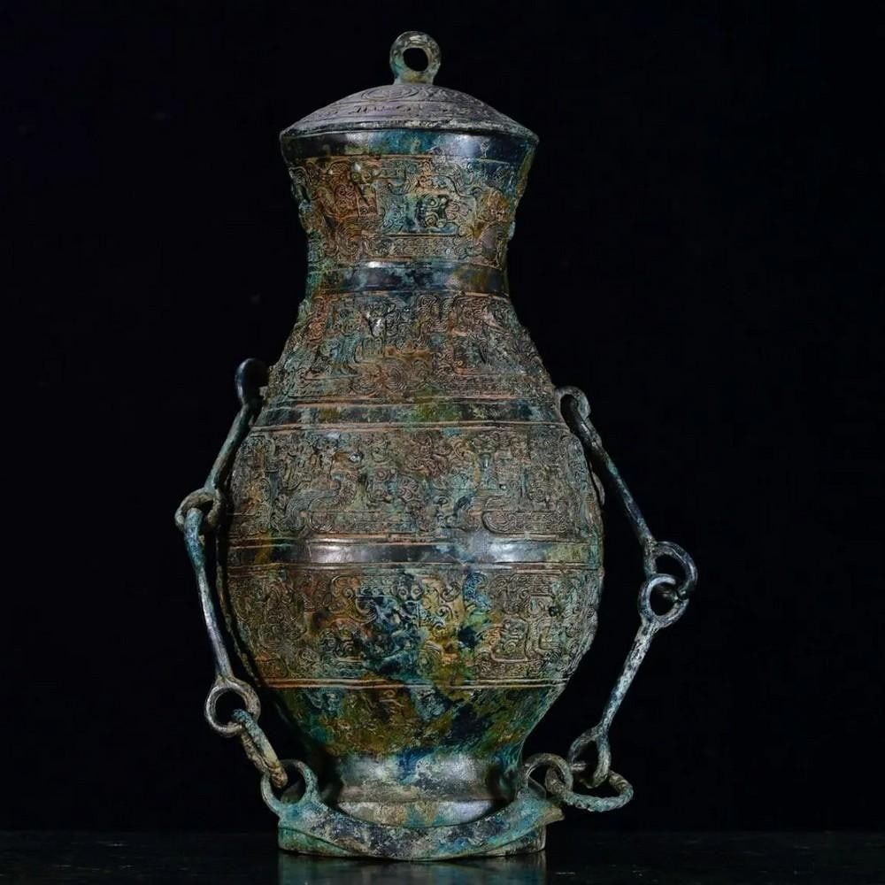 Antique Chinese Bronze Snake-Chain Bottle Ornament: Antique Chinese Bronze Snake-Chain Bottle Ornament This rare handcrafted bronze bottle features a unique snake-chain design, symbolizing flexibility and strength in Chinese culture. Meticulously detai