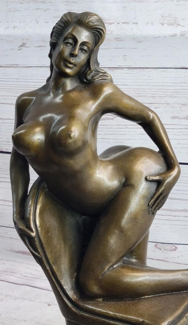 Female Exhibitionist on Chair Inspired Bronze Statue - 13" x 6.5": Female Exhibitionist on Chair Inspired Bronze Statue - 13" x 6.5" This bronze sculpture depicts an elegant woman in a confident, alluring pose, seated gracefully on a chair. Her form is meti