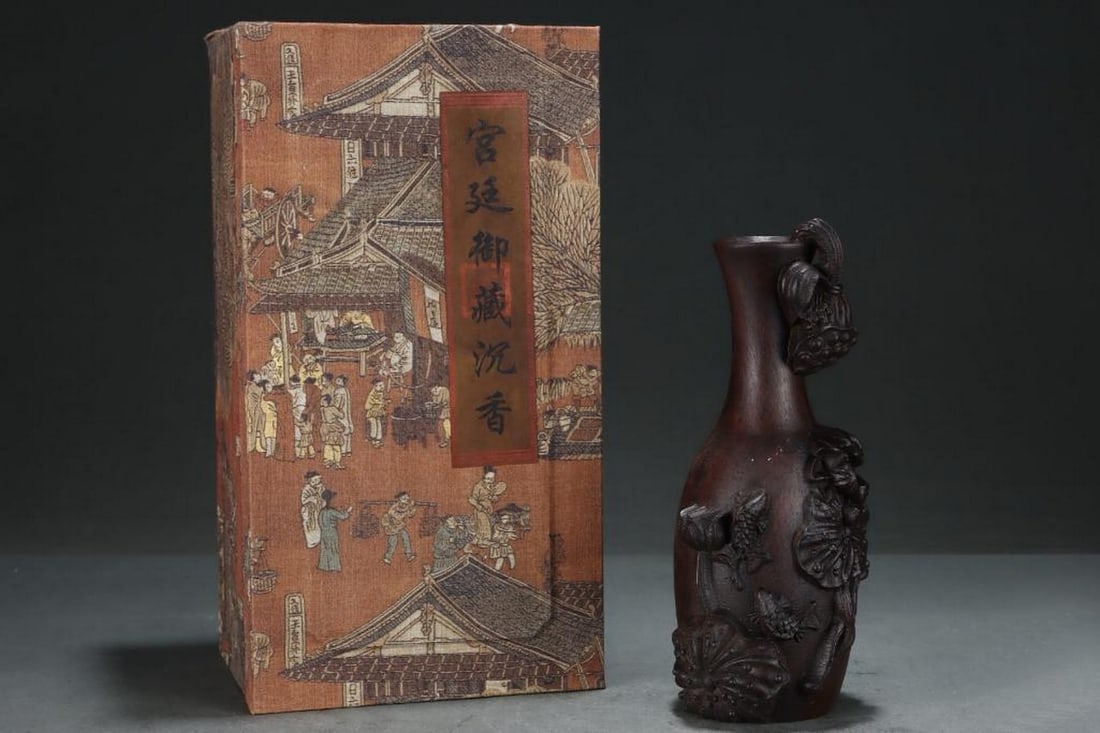 Inspired Palace Antique Agarwood Vase – Engraved with Fish and Flower Motifs: Inspired Palace Antique Agarwood Vase – Engraved with Fish and Flower Motifs This exquisite agarwood vase inspired from an old palace collection is intricately engraved with elegant fish and floral