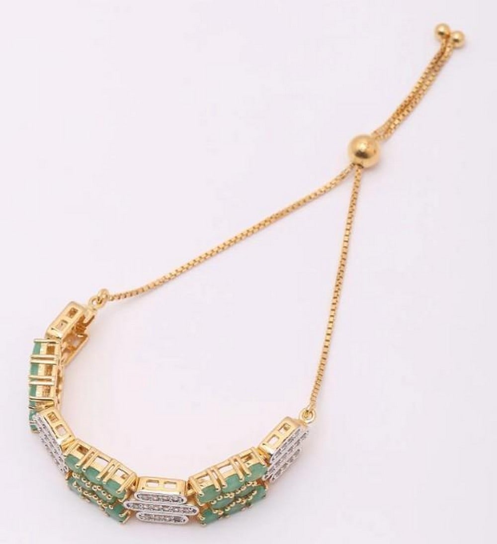 Verdant Glow & White Topaz Wraparound: Verdant Glow & White Topaz Wraparound This elegant wraparound bracelet pairs the lush green of faceted emerald gemstones with the bright sparkle of white topaz. Designed to gracefully coil