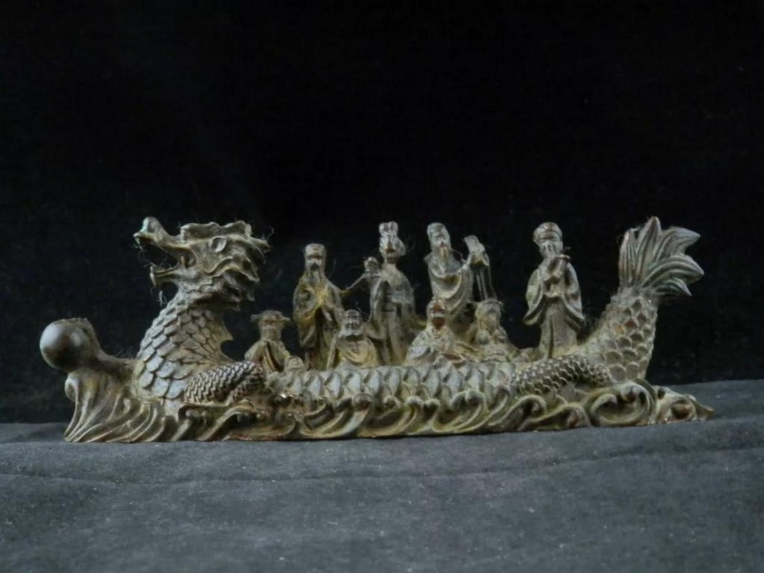 6.5-Inch Handcrafted Chinese Bronze Dragon Ship with 8 Figures: 6.5-Inch Handcrafted Chinese Bronze Dragon Ship with 8 Figures This 6.5-inch handcrafted Chinese bronze dragon ship is a stunning piece of art. It features a detailed dragon head at the prow and a sc