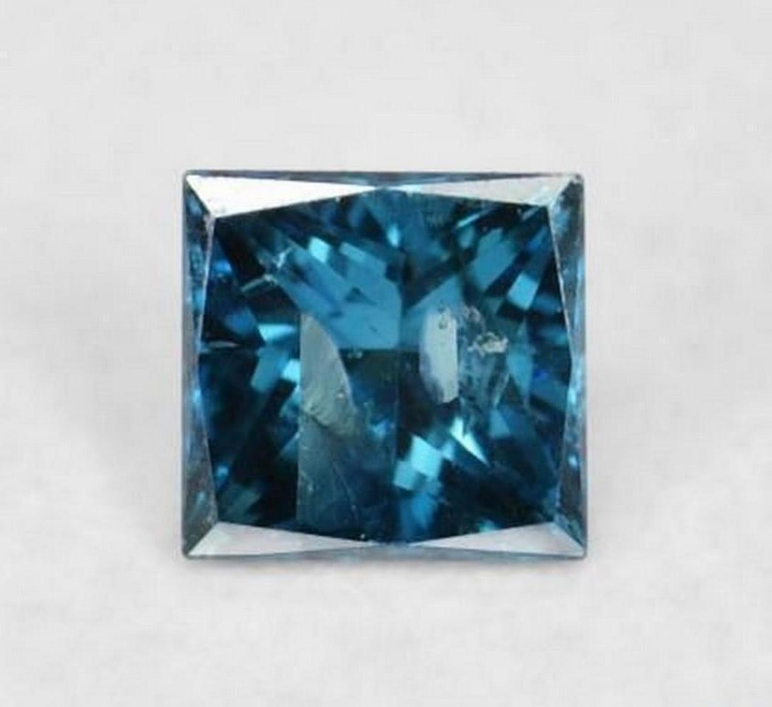 0.07 ct Natural Blue Diamond, Princess Cut, VS–SI, India: 0.07 ct Natural Blue Diamond, Princess Cut, VS–SI, India Natural blue diamond weighing 0.07 carats, cut in a princess (square) shape. The gem measures 2.37 x 2.37 x 1.59 mm and has VS–SI clarity.
