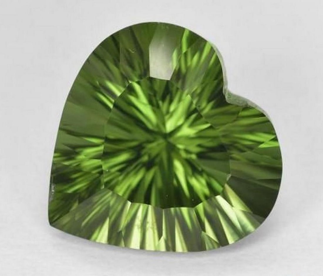 7.24 ct Natural Deep Green Chrome Diopside, Heart Shape, VS, Brazil: 7.24 ct Natural Deep Green Chrome Diopside, Heart Shape, VS, Brazil Natural chrome diopside gemstone weighing 7.24 carats, cut in a heart-shaped concave cut. The gem measures 12.96 x 12.87 x 8.40 mm