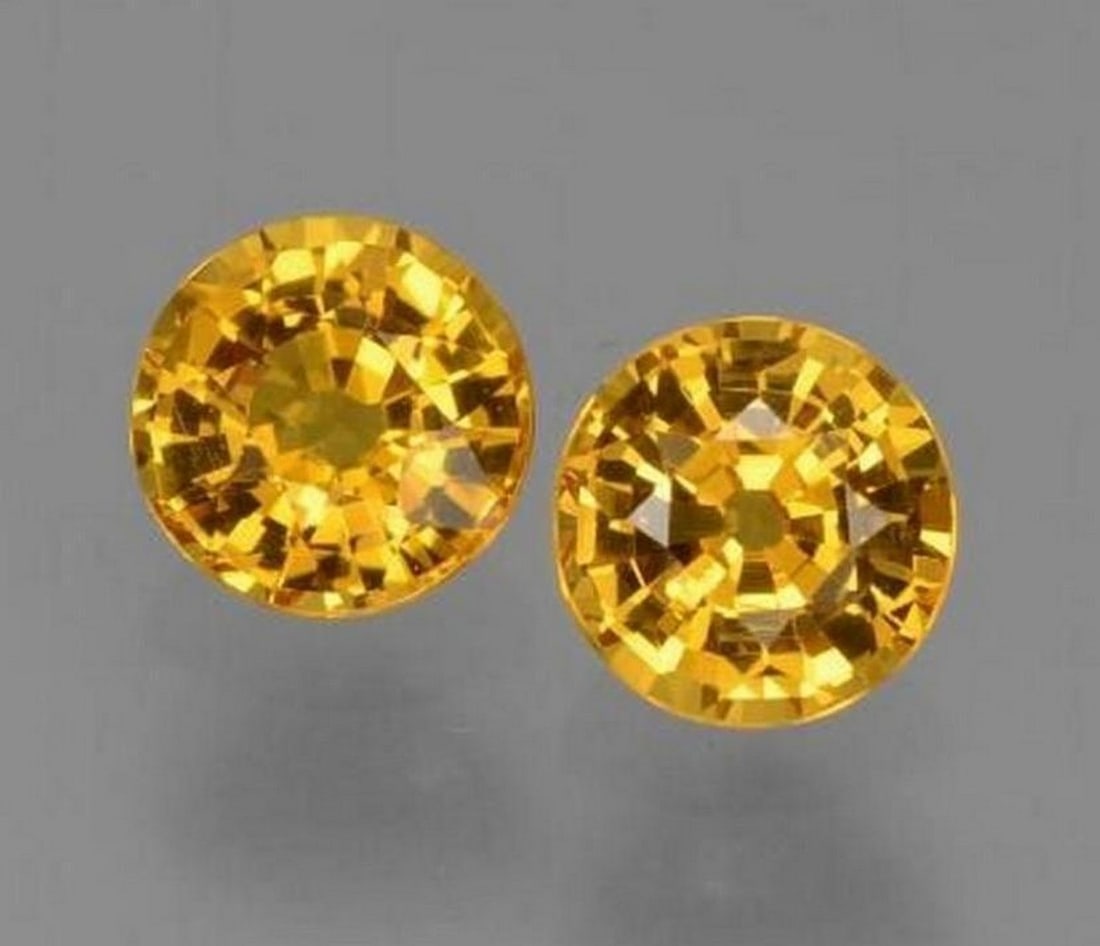 1.21 ct Total Natural Medium Golden Sapphire, Round Cut, VVS, Tanzania (2 Gems): 1.21 ct Total Natural Medium Golden Sapphire, Round Cut, VVS, Tanzania (2 Gems) Two natural medium golden sapphires totaling 1.21 carats, each cut in a round facet shape. Each gem measures