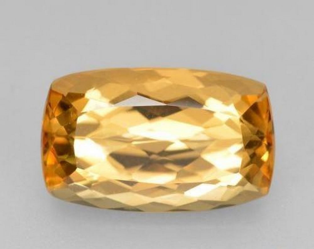 4.48ct Cushion Cut Bright Orange Imperial Topaz: 4.48ct Cushion Cut Bright Orange Imperial Topaz Type: Imperial Topaz Weight: 4.48 ct Size:12.2 x 7.6 x 5.5 mm Shape: Cushion-Cut Color: Bright Orange Clarity: VVS Treatment:
