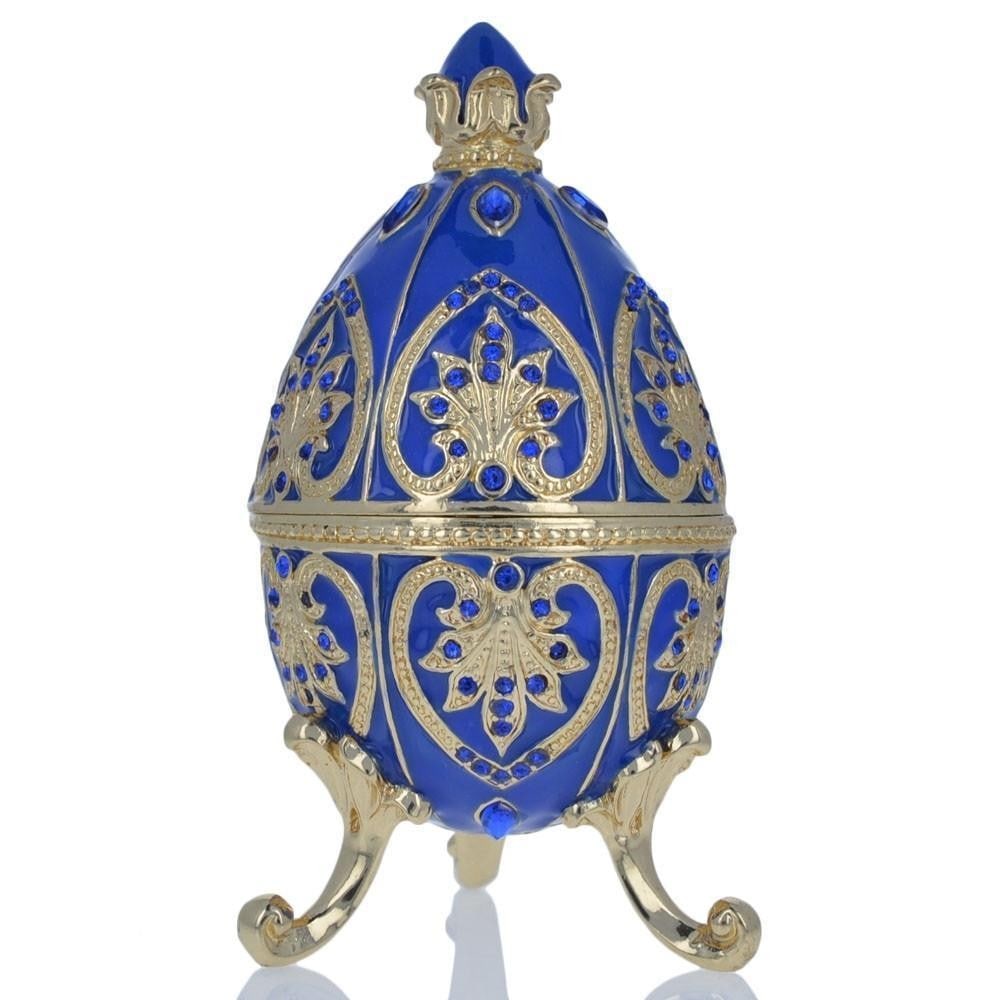 Blue Jewel Royal Crown Royal Inspired Russian Inspired Egg: Blue Jewel Royal Crown Royal Inspired Russian Inspired Egg You'll love the elegance of this blue-hued Royal inspired Russian egg. A display stand attached to this beauty. Fashioned from fine
