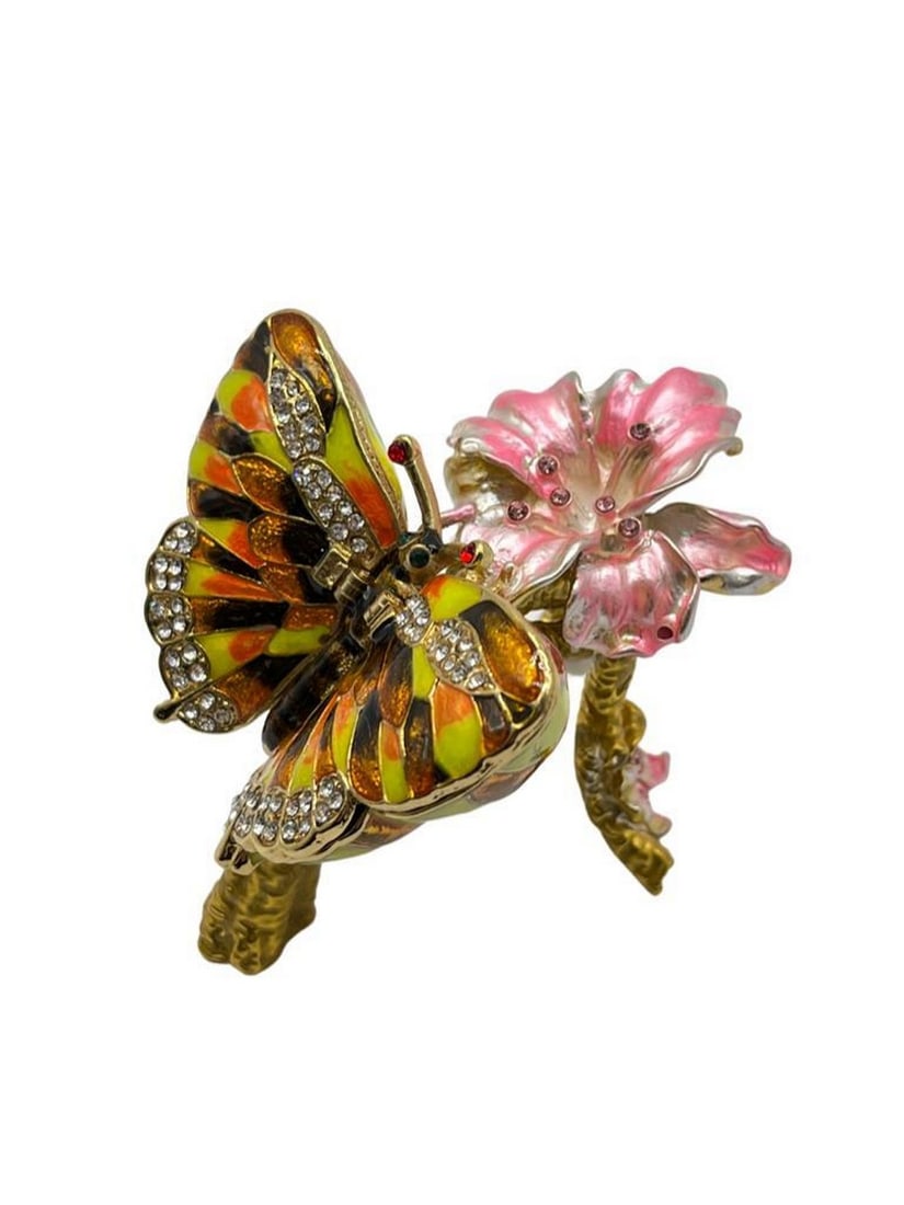 Butterfly & Flower Trinket Box: Butterfly & Flower Trinket Box A captivating and graceful piece that captures the essence of nature's beauty. Crafted from high-quality metal, this trinket box features a stunning design