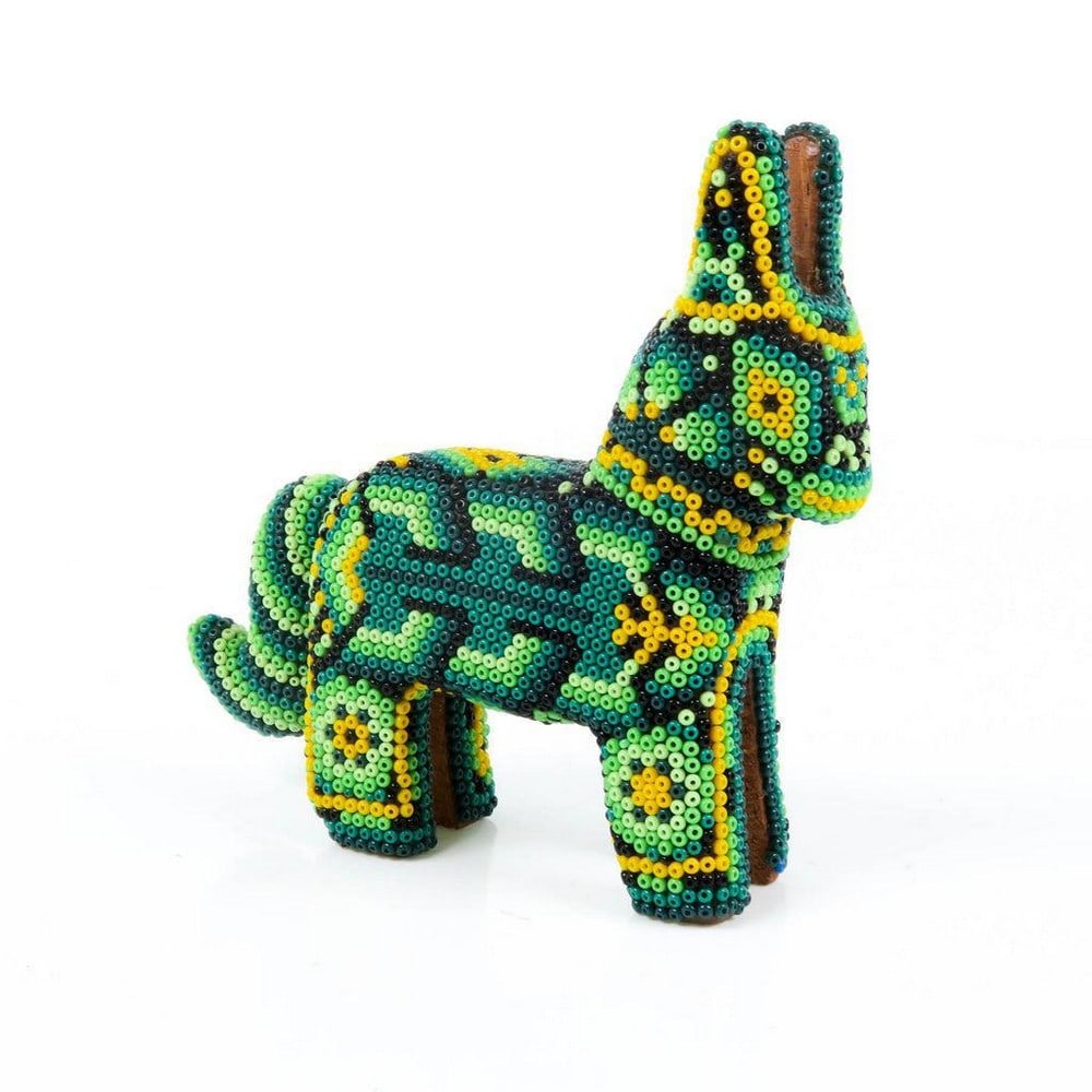 Huichol Beaded Green Donkey Sculpture: Huichol Beaded Green Donkey Sculpture Exquisite handcrafted by the indigenous Huichol community of Jalisco, this magnificent beaded deer showcases their exceptional artistry. Crafted from wood, the d