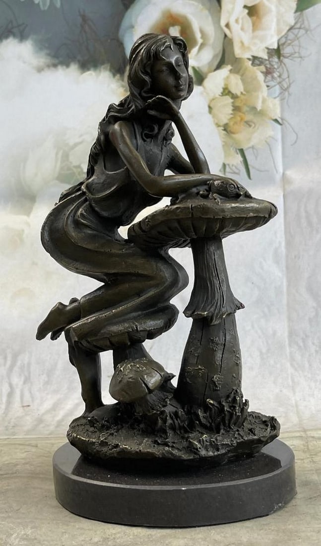 Girl Sitting on Mushroom Toadstool Original Bronze Sculpture Signed by J. Mavchi - 9.5" x 5": Girl Sitting on Mushroom Toadstool Original Bronze Sculpture Signed by J. Mavchi - 9.5" x 5" Step into a whimsical world with our enchanting bronze figure sculpture featuring a girl sitting at