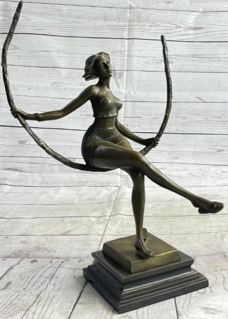 Moonlit Elegance: Sexy Woman on Swing Bronze Sculpture: Moonlit Elegance: Sexy Woman on Swing Bronze Sculpture Boldly sensual and gracefully poised, this bronze sculpture features a captivating woman seated on an abstract swing crafted from a sweeping hal