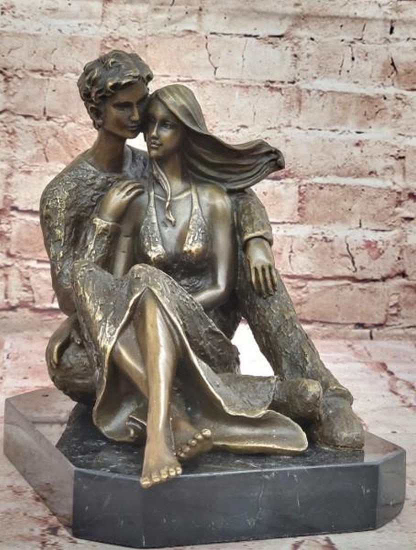 Together Always Bronze Sculpture: Together Always Bronze Sculpture This beautifully crafted bronze sculpture, bearing the signature of artist Aldo Vitaleh, captures a tender moment of romantic intimacy. The couple sits closely entwin
