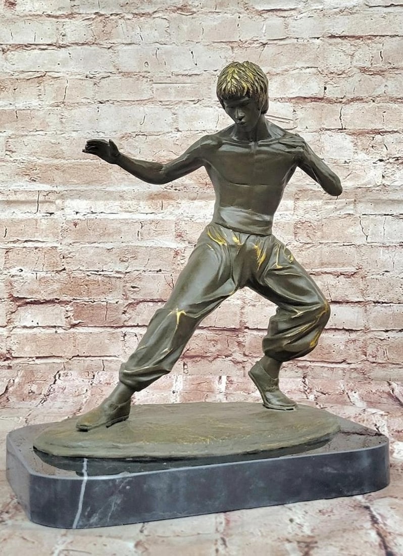 Bruce Lee Copper Martial Arts Sculpture by Mavchi - 15" x 12.5": Bruce Lee Copper Martial Arts Sculpture by Mavchi - 15" x 12.5" This limited edition copper sculpture by Mavchi captures the fierce spirit and enduring legacy of Bruce Lee in striking detail.