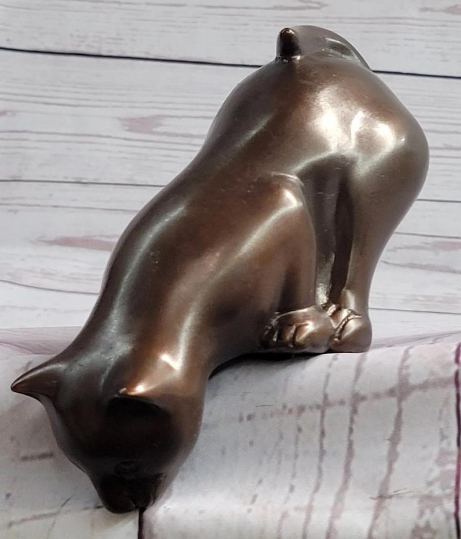 Signed Original Curious Kitten Bronze Sculpture - 3" x 6": Signed Original Curious Kitten Bronze Sculpture - 3" x 6" This delightful bronze sculpture captures the essence of a typical cat as it lounges on the edge of something, enjoying its surroundi