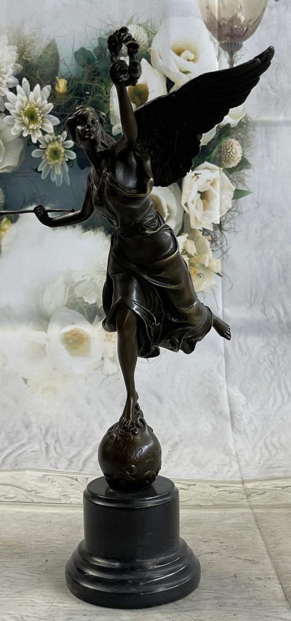 Winged Victory Athena Standing On Globe 15'' Bronze Marble Sculpture - 8lbs: Introducing a captivating bronze sculpture that embodies the enchanting spirit of an angel ready to take flight. This charming piece depicts an angel gracefully perched atop a rock, poised to blow her