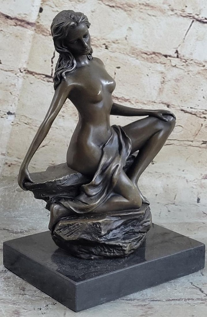 Exquisite Nude Female Bronze Sculpture: Exquisite Nude Female Bronze Sculpture This pose of a peaceful girl sitting with downcast eyes captures the true rebirth of the innocence age. The artist was able to depict elegant nudity that even s