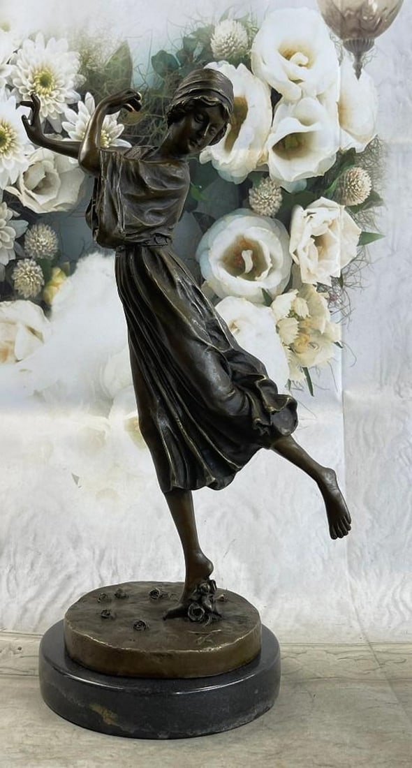 Dancing Woman on One Foot Bronze Sculpture: Dancing Woman on One Foot Bronze Sculpture As she dances graciously across the stage, her onlookers throw roses to her for her wonderful display. She is lost in a world of dance as she lifts her leg