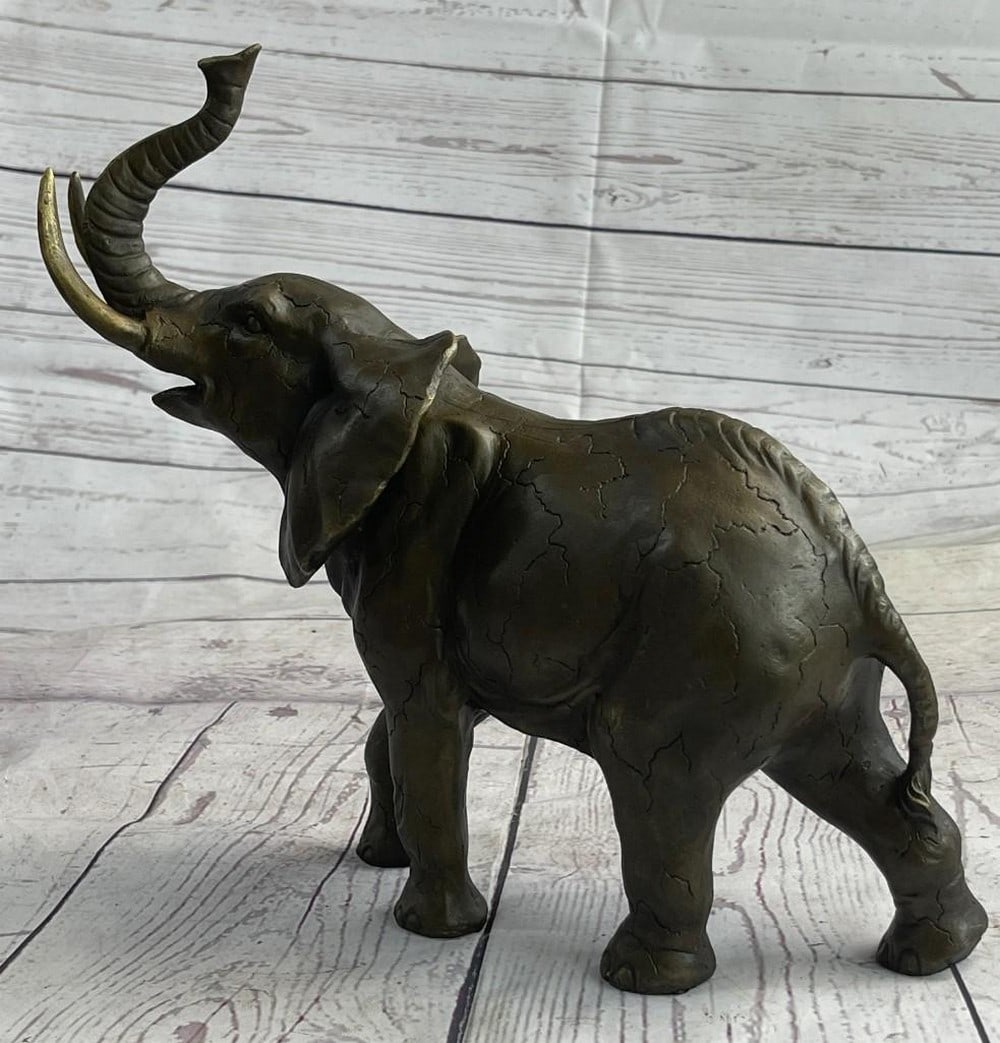 Elephant Bronze Sculpture: Elephant Bronze Sculpture Many don`t consider the elephant for its beauty and grace but rather its size and funny trunk, but there is something to love about this large creature besides Walt Disn