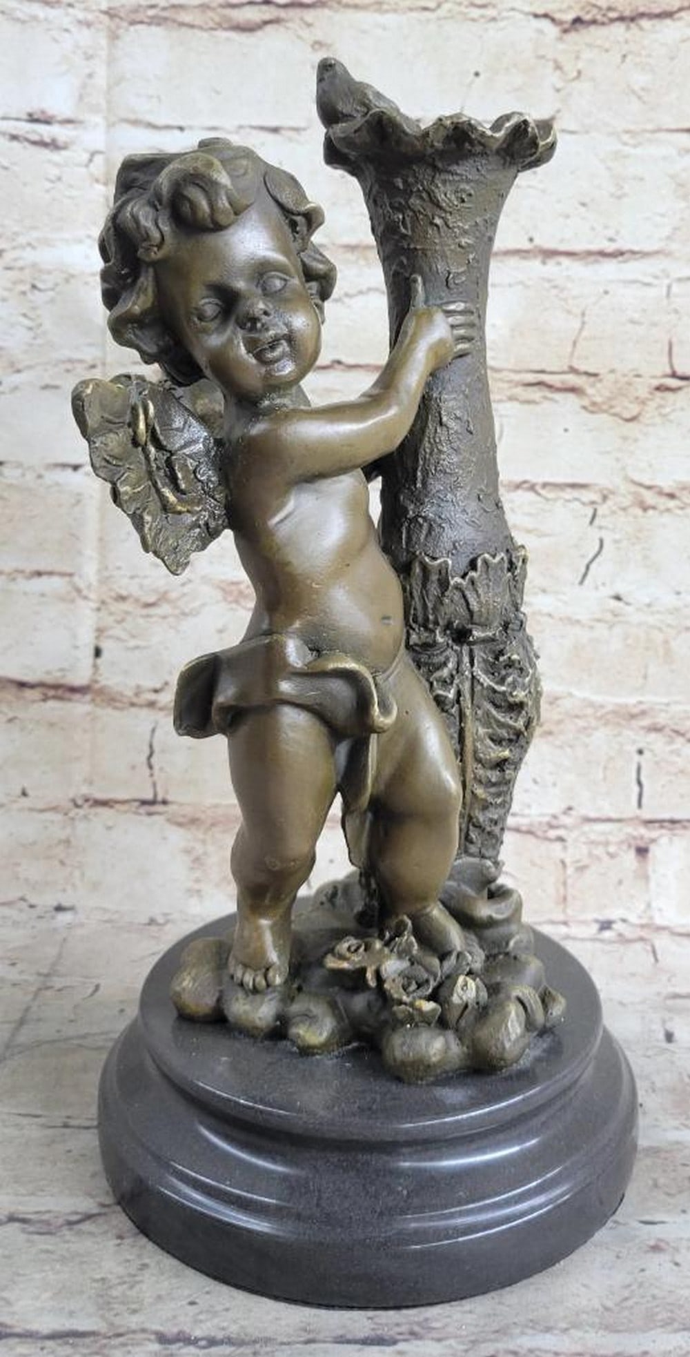 Cherub Angel Bronze Sculpture On Marble Base - 12" x 5.5": Cherub Angel Bronze Sculpture On Marble Base - 12" x 5.5" The cherubic angel seems to have just landed from great heights among the ruins of an old enchanted garden. He holds himself steady f