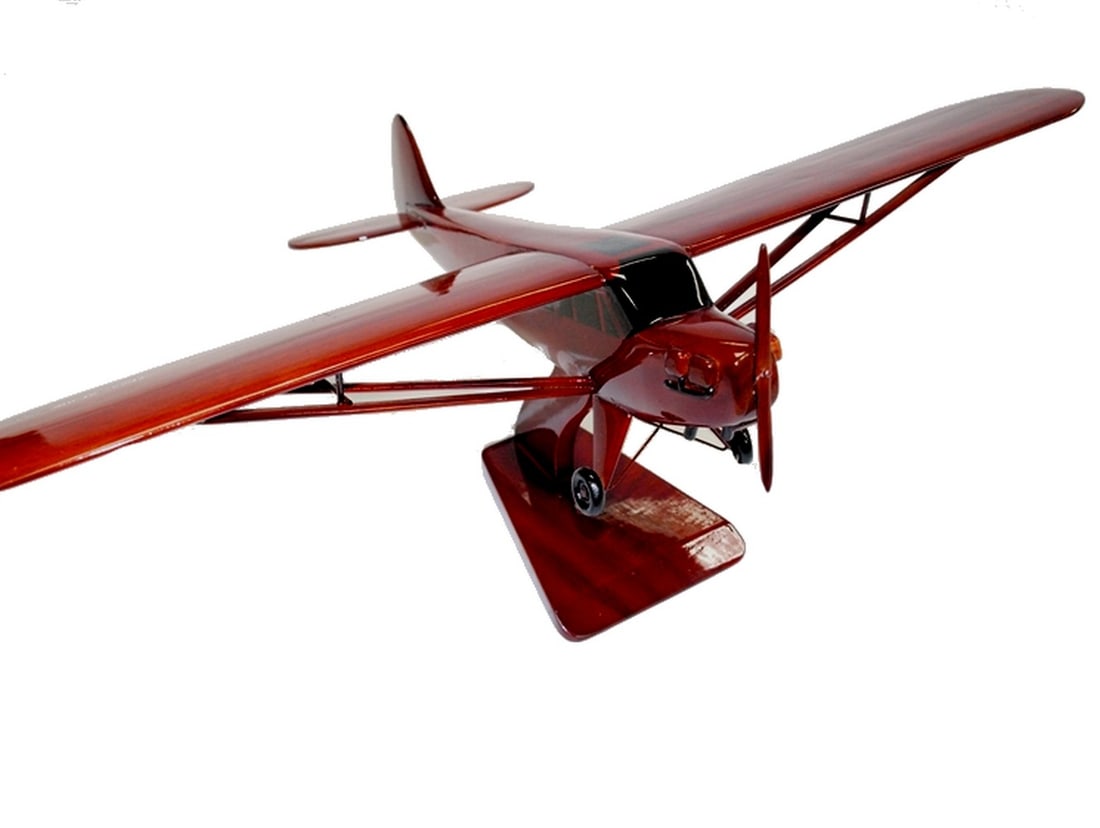 PIPERCUB' Handcrafted Wooden Model: 'PIPERCUB' Handcrafted Wooden Model Experience the timeless charm of aviation with the Piper Cub Solid Mahogany Scale Model, a masterpiece meticulously crafted for enthusiasts. Made from