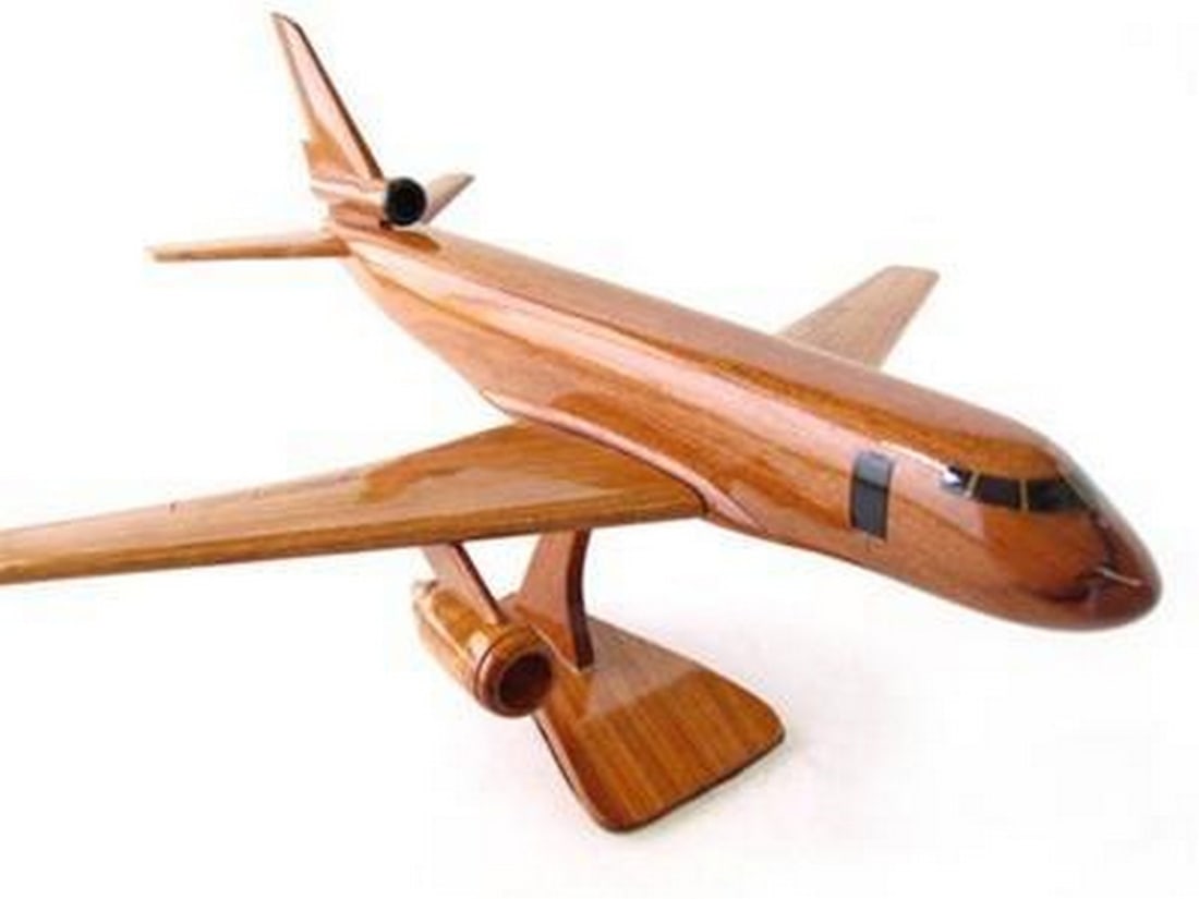KC-10 Extender: KC-10 Extender The KC-10 in-flight refueler has served the US Air Force for decades. This handcrafted mahogany scale model is a remarkable replica with fine details in natural wood finished with high