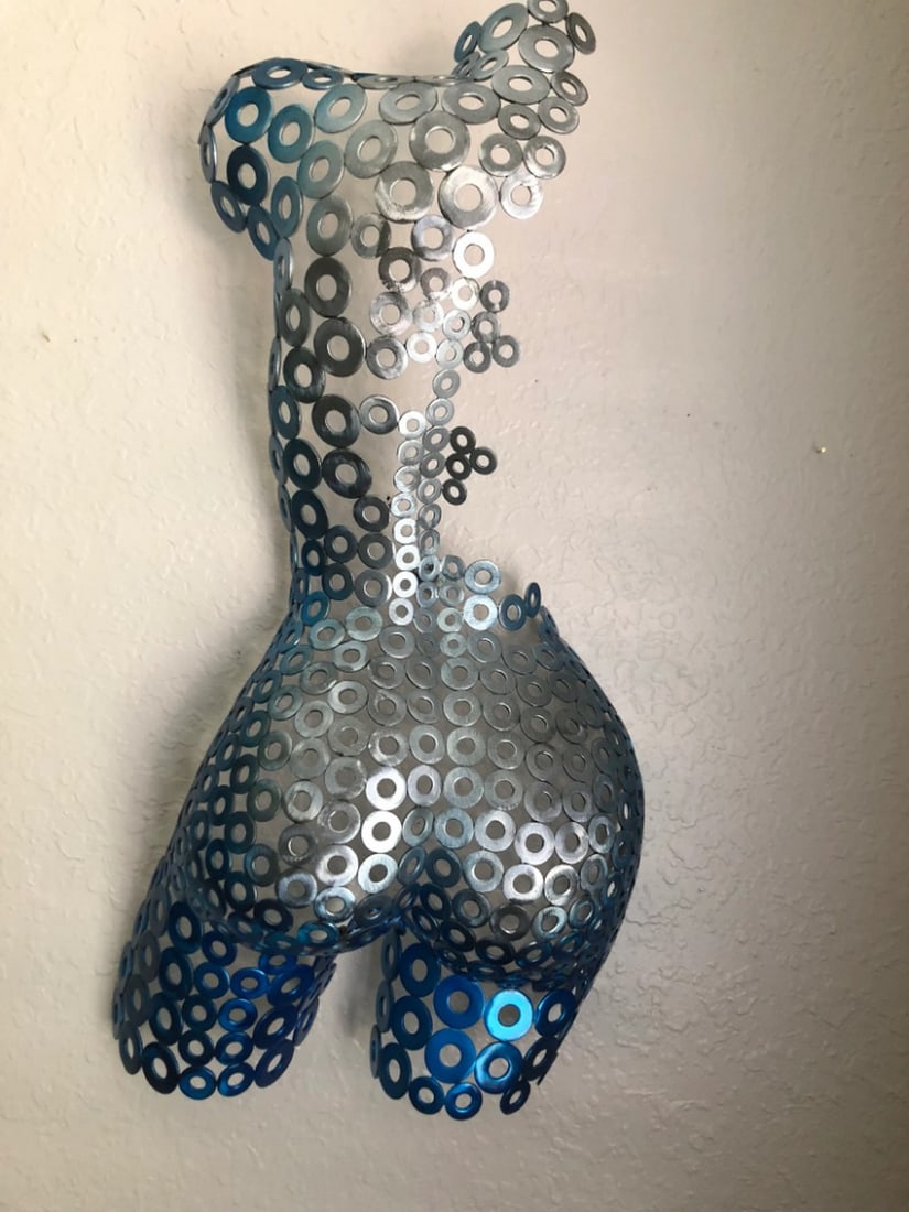 Dark Blue Metal Female Torso Sculpture: Dark Blue Metal Female Torso Sculpture Handcrafted, this magnificent female torso is a unique and striking addition to any art collection. The work transcends metal, blending sculpture and painting to