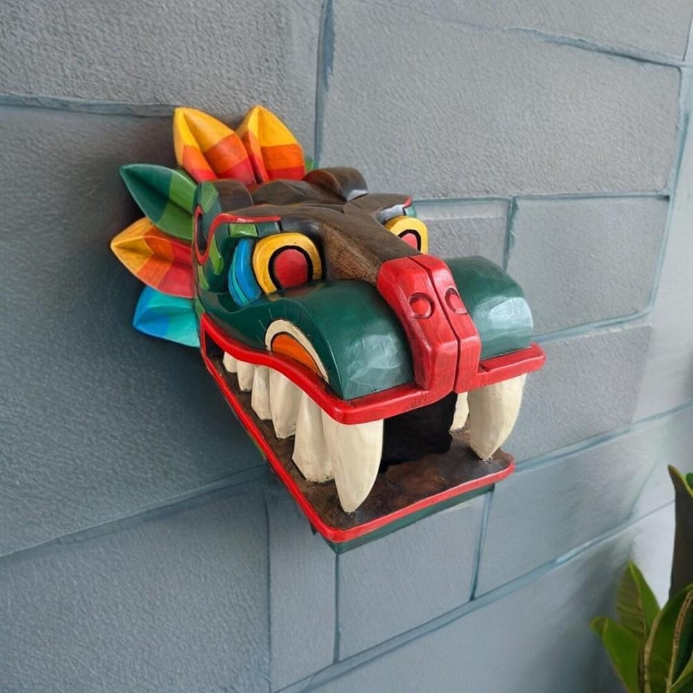 Kukulkan Hand-Carved Cedar Wood Wall Art: Kukulkan Hand-Carved Cedar Wood Wall Art This stunning hand-carved cedar wood piece depicts Kukulkan, the revered feathered serpent deity of Mayan mythology. A symbol of wisdom, power, and the forces