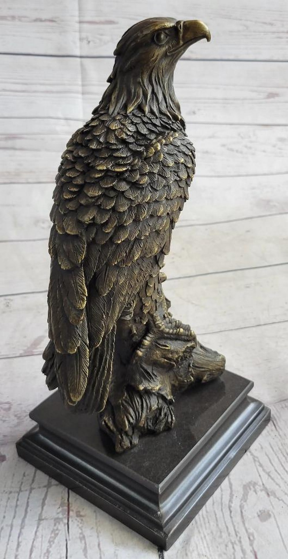 Eagle Perched on Nest Bronze Sculpture – 12" x 8.5": Eagle Perched on Nest Bronze Sculpture – 12" x 8.5" This bronze sculpture captures a majestic eagle perched on its nest, talons outstretched and poised for flight. The meticulously sculpted