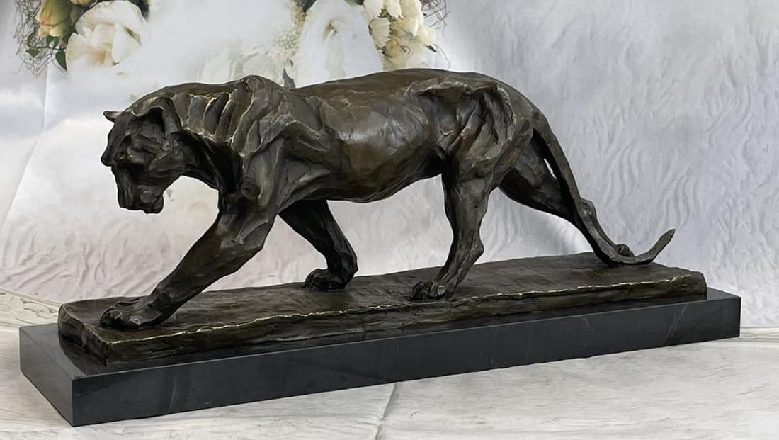 African Lioness Marble Based Bronze Sculpture - 8" X 21": African Lioness Marble Based Bronze Sculpture - 8" X 21" A lioness wanders through her wild African habitat after chasing away a predator from her cubs. She is fierce yet nurturing, ready to